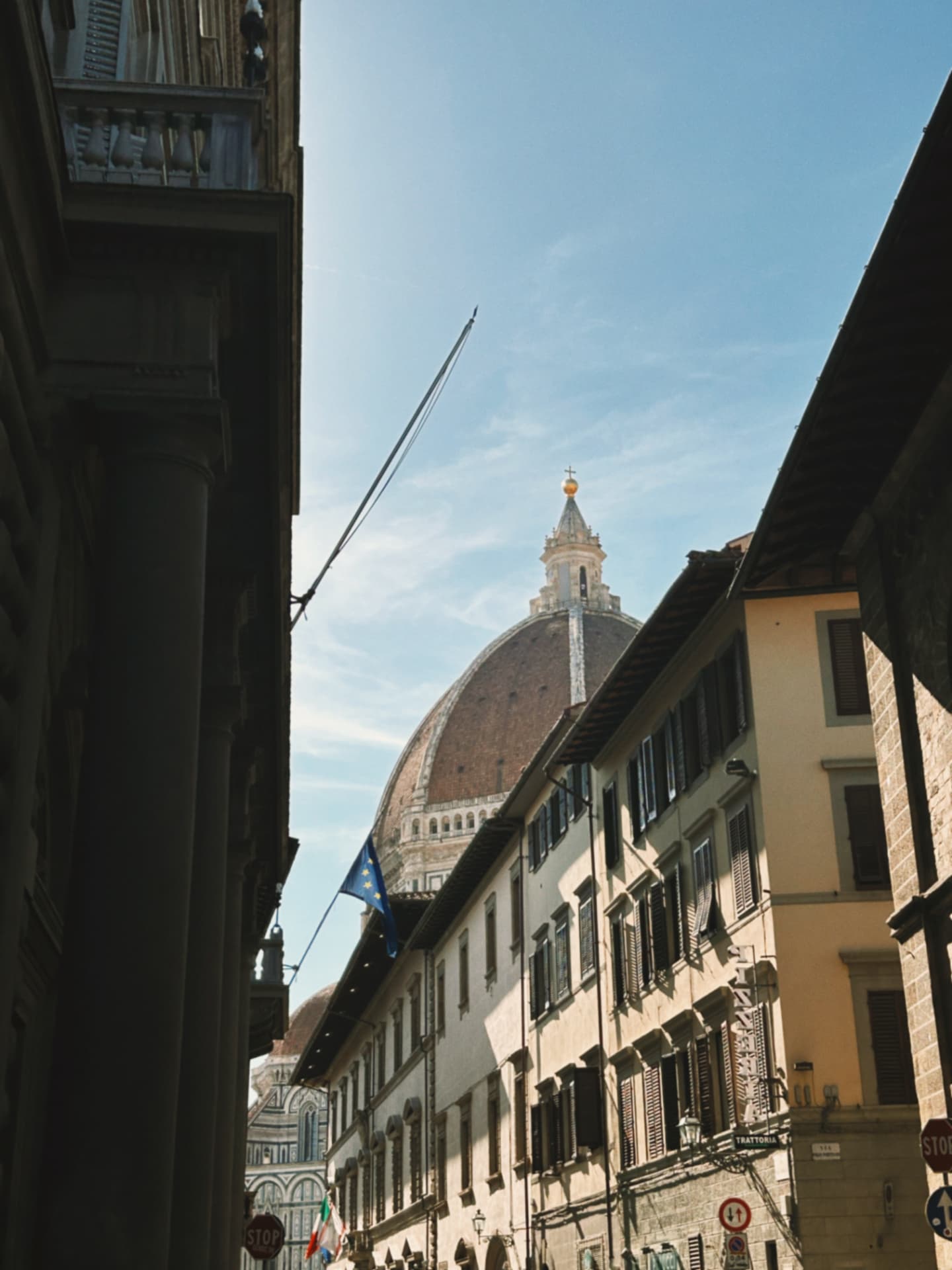 the cathedral dome seen from a narrow street