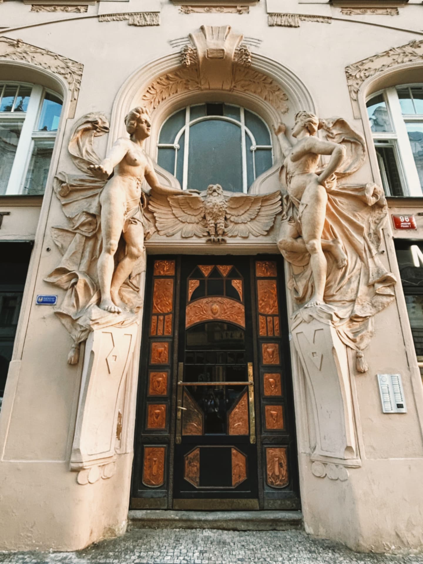 sculpted figures framing an ornate doorway