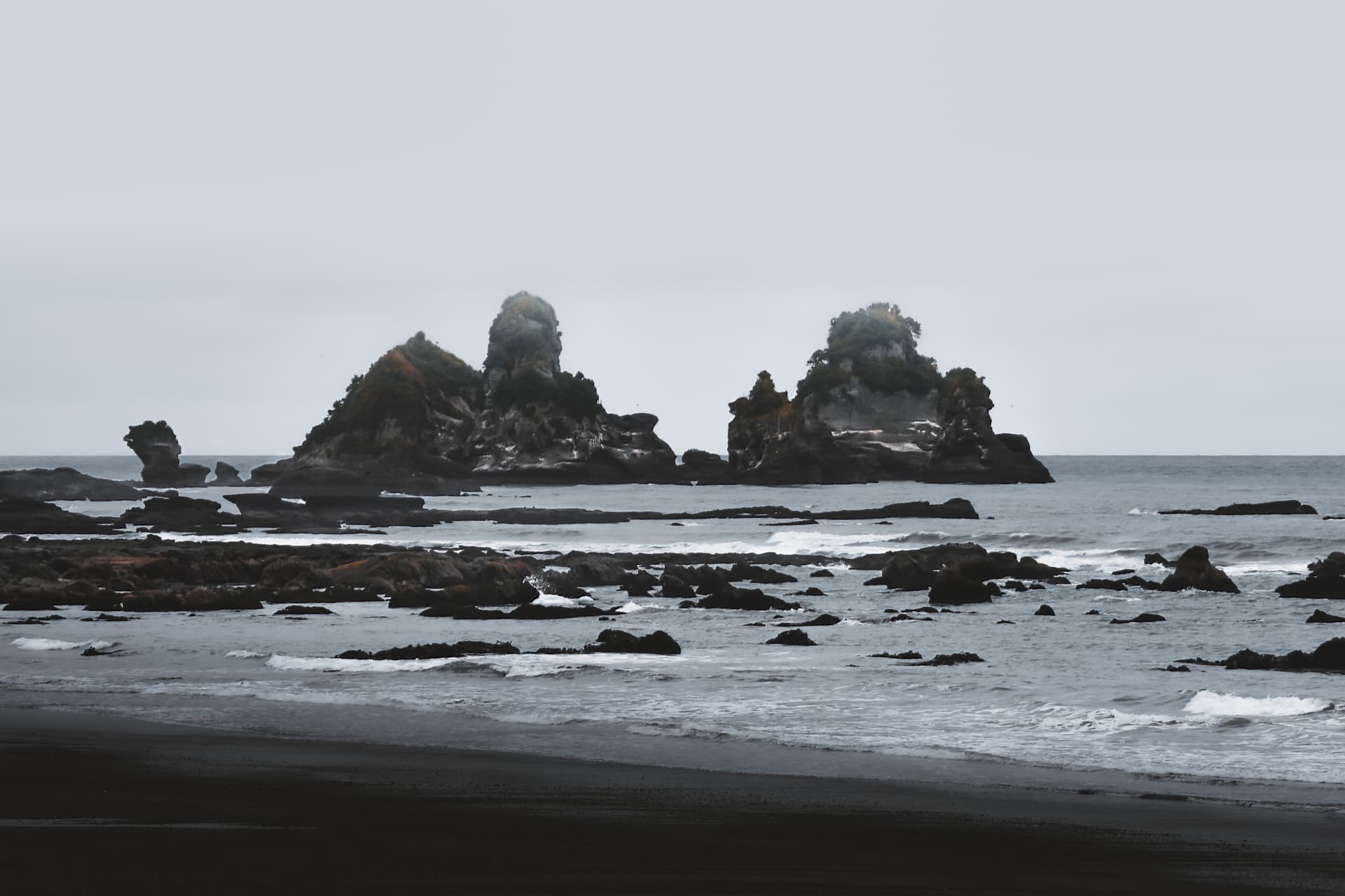 Rocky islets standing in a grey sea