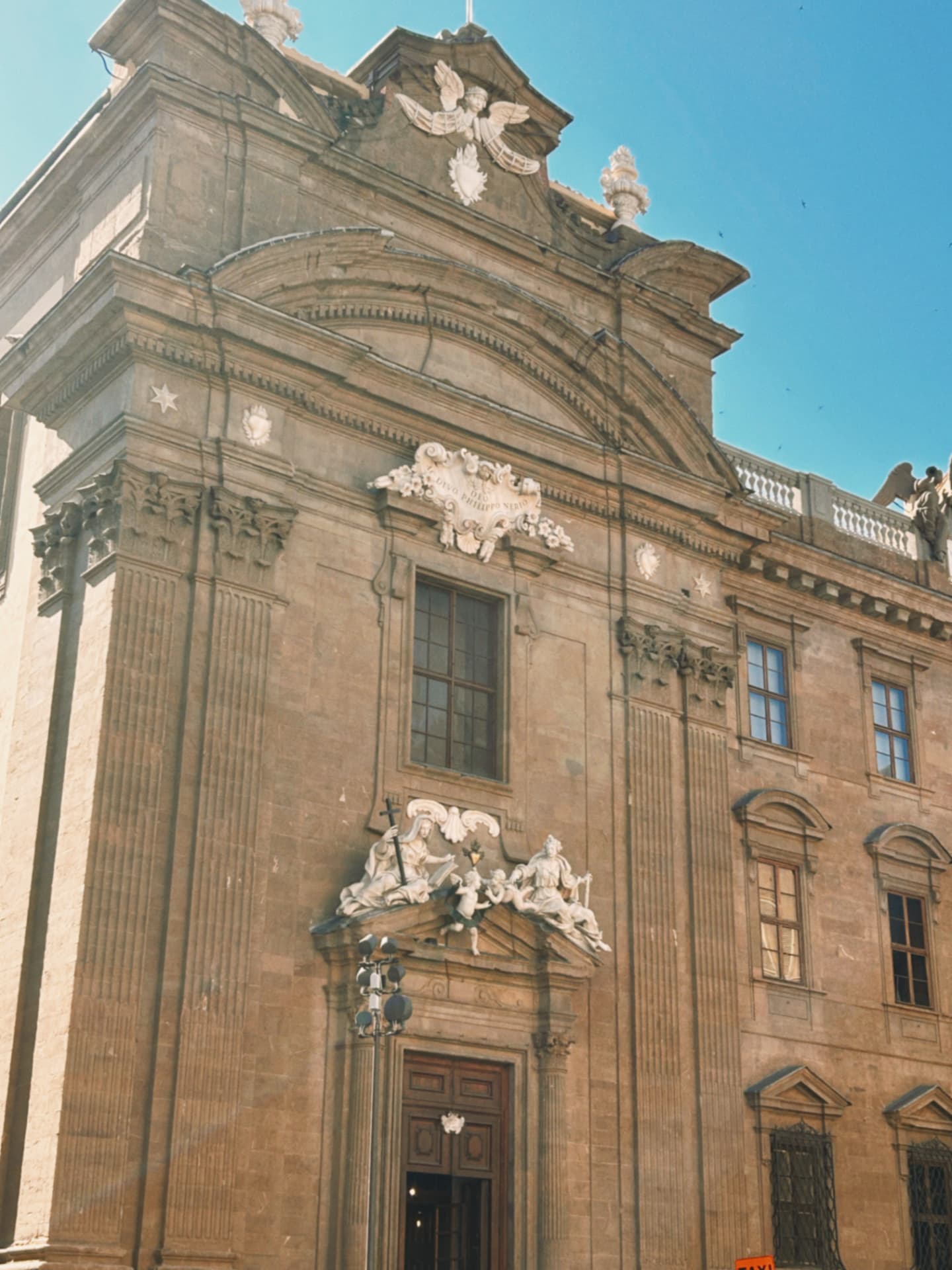 a baroque church facade with sculpted figures