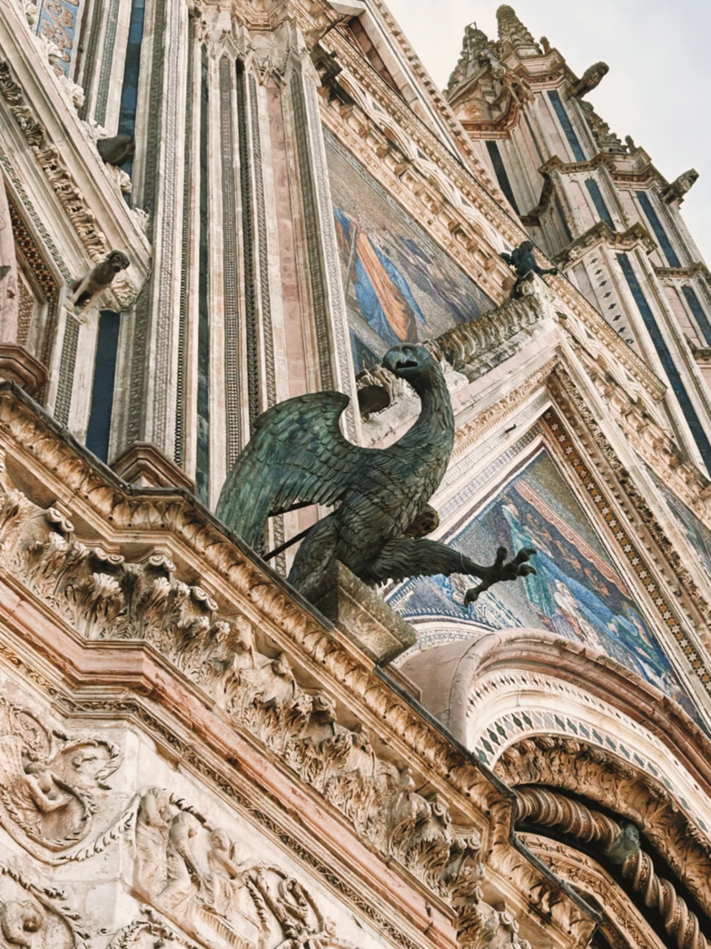 cathedral facade crowned by a carved eagle