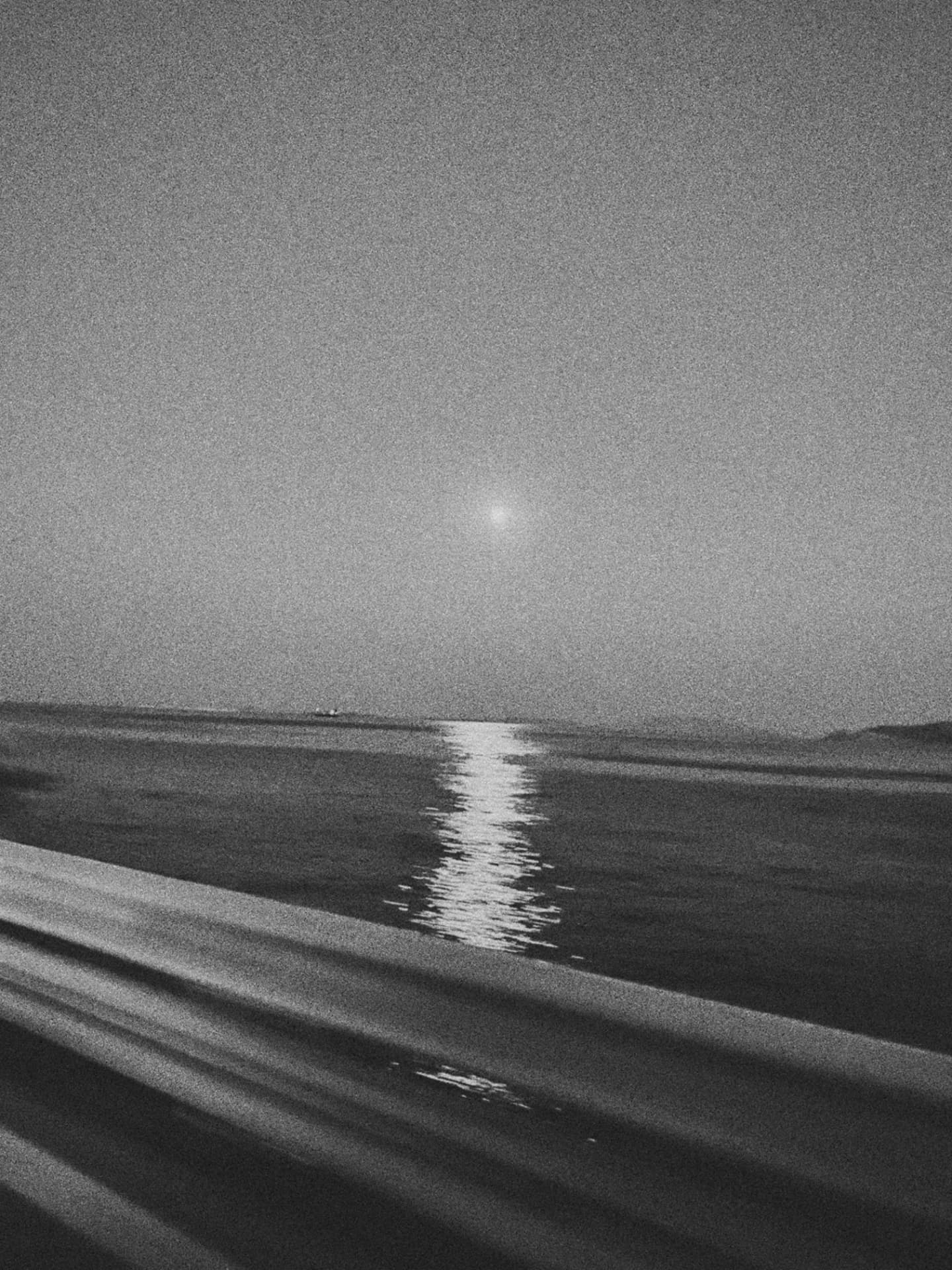 A moonlight trail rippling across dark water
