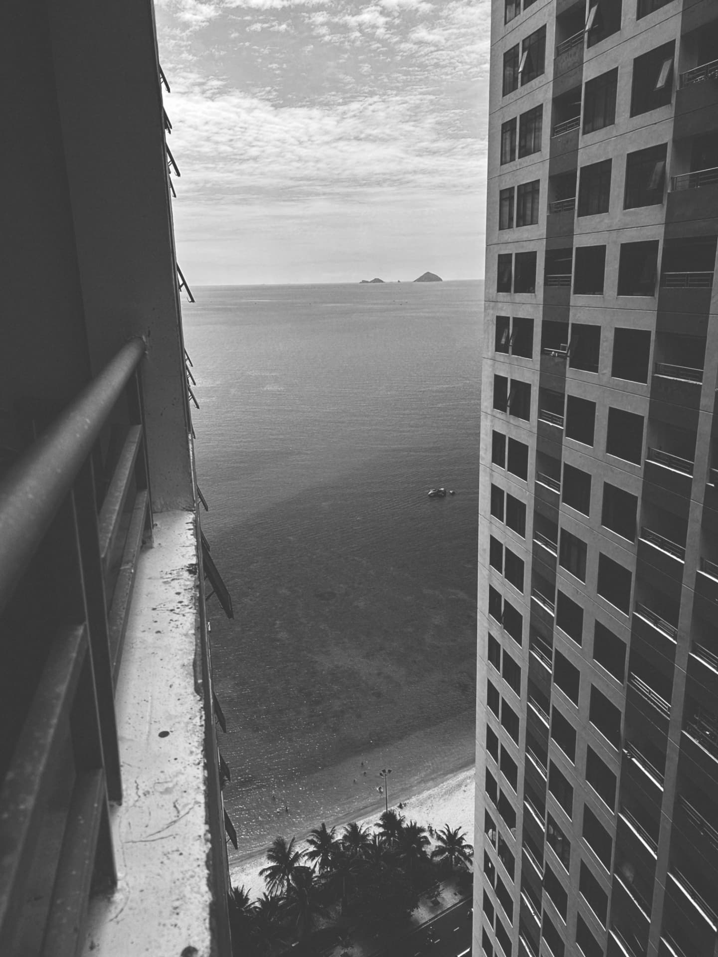 The sea framed between two pale tower walls